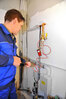 The LeckOmiO gas leak detector and pressure gauge in use